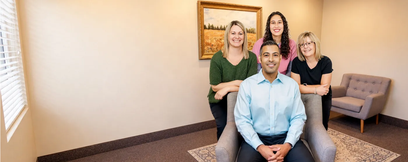 The smiling dentist and team at Beaumont Village Dentistry